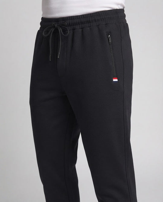 Herren Sportliche Joggerhose mit Reißverschlusstasche, elastischem Bund und geripptem Saum Shop Nory