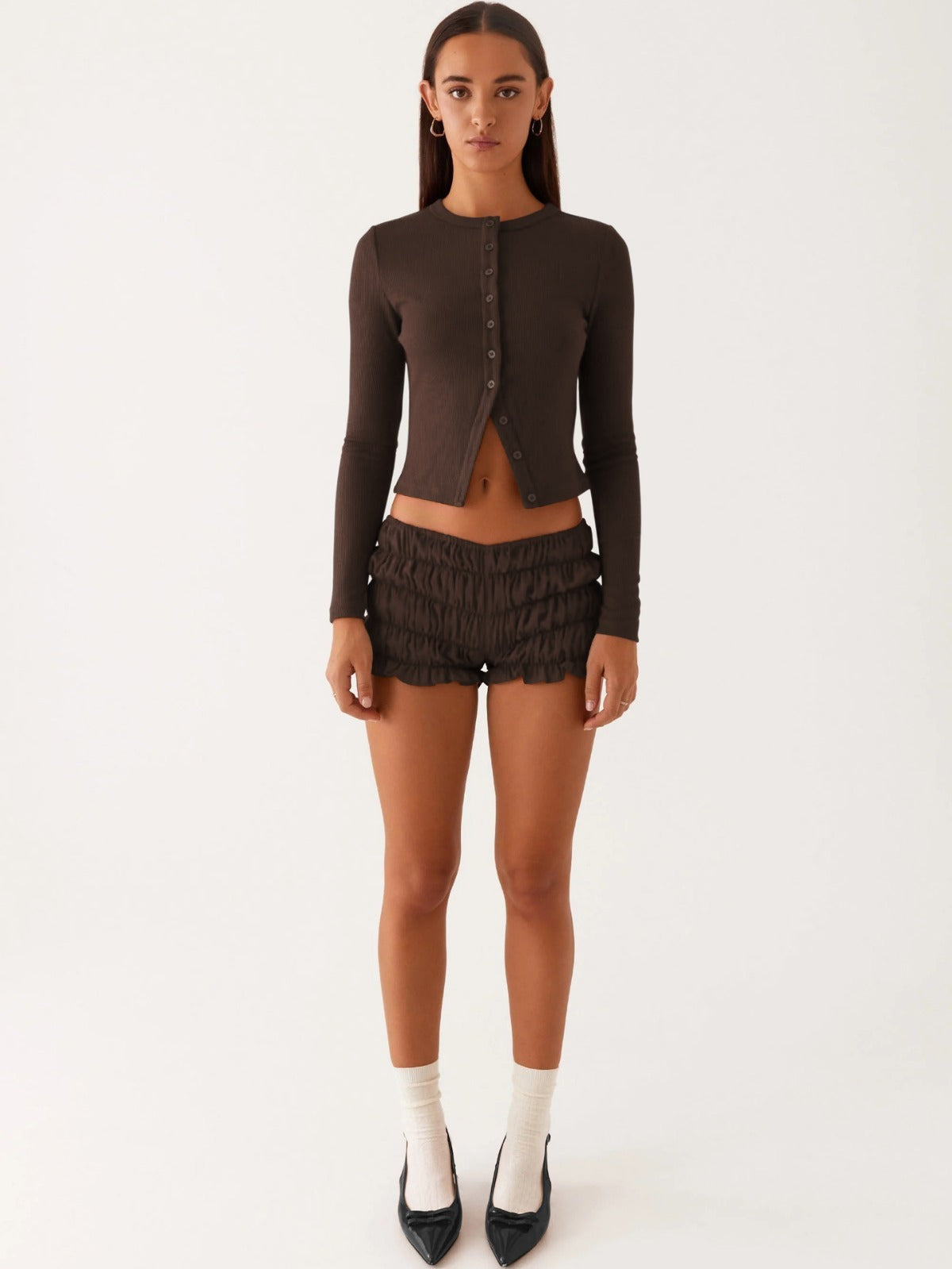 Einfarbige schmal geschnittene lange Strickjacke