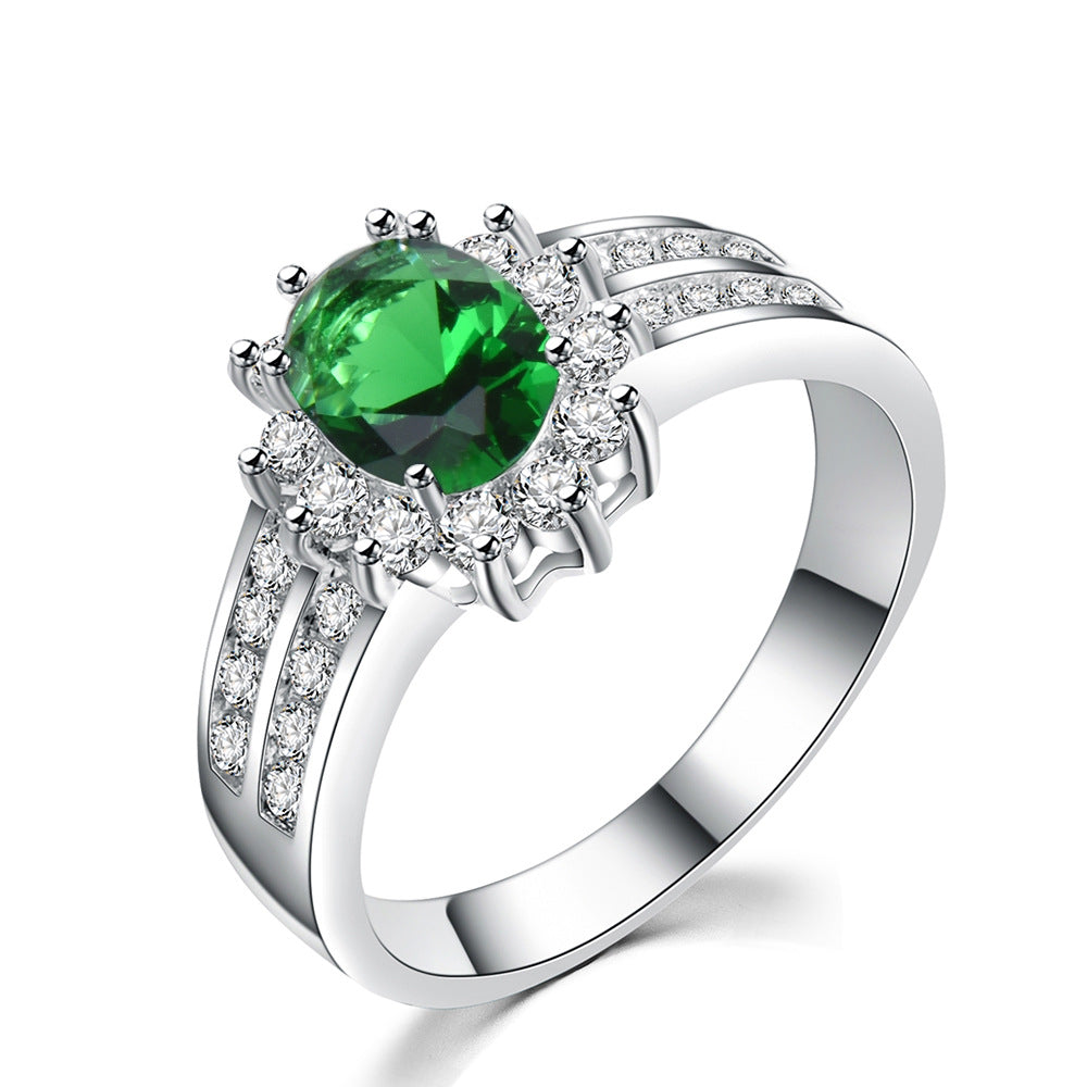 Damen Ring mit funkelndem grünem Edelstein und exquisiten Zirkonia-Verzierungen Shop Nory