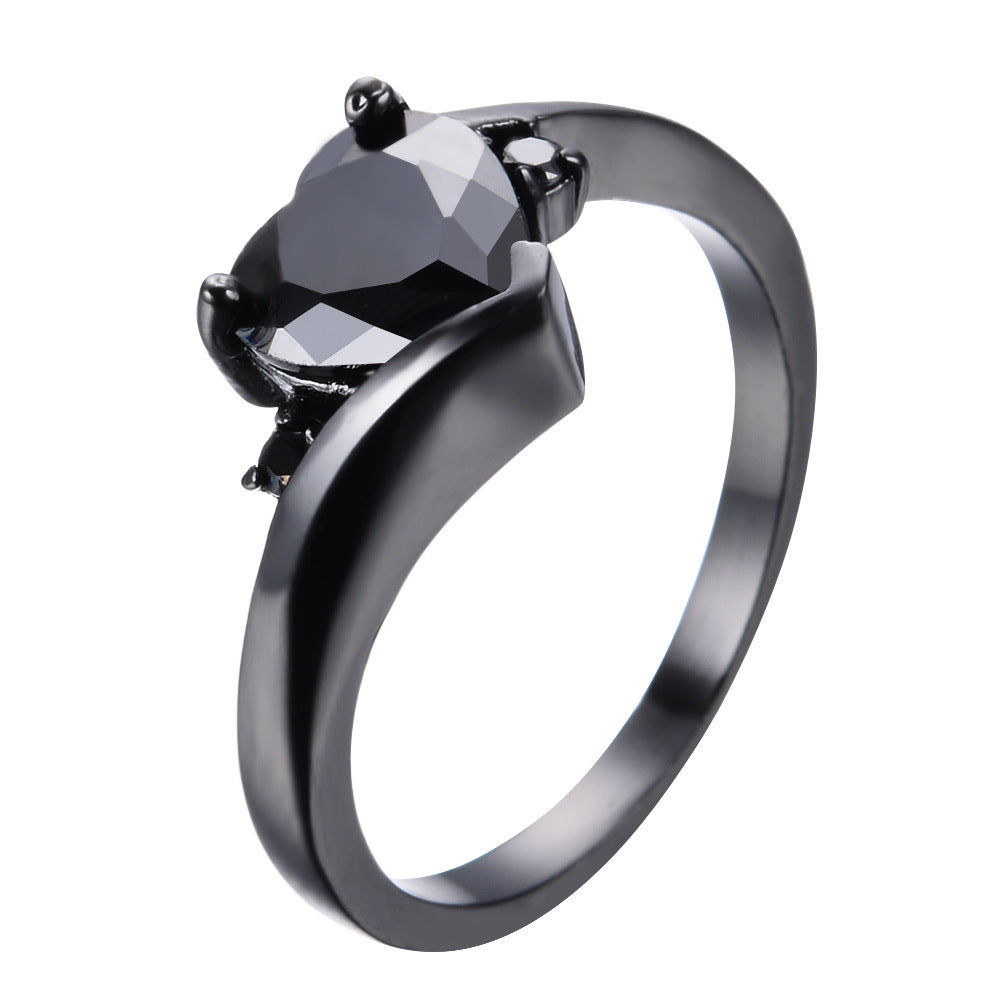 Damen Ring mit herzförmigem blauen Zirkonstein und eleganter schwarzer Fassung Shop Nory