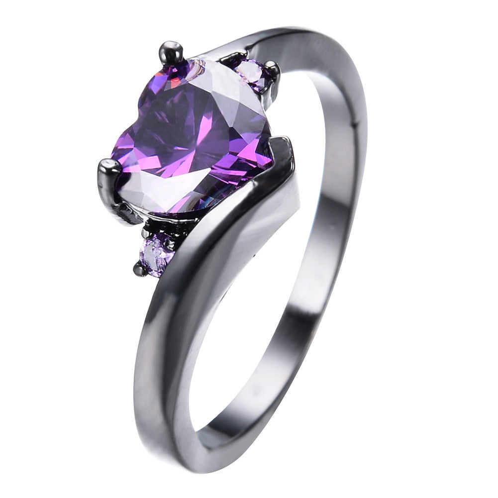 Damen Ring mit herzförmigem blauen Zirkonstein und eleganter schwarzer Fassung Shop Nory