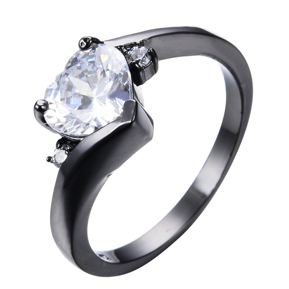 Damen Ring mit herzförmigem blauen Zirkonstein und eleganter schwarzer Fassung Shop Nory
