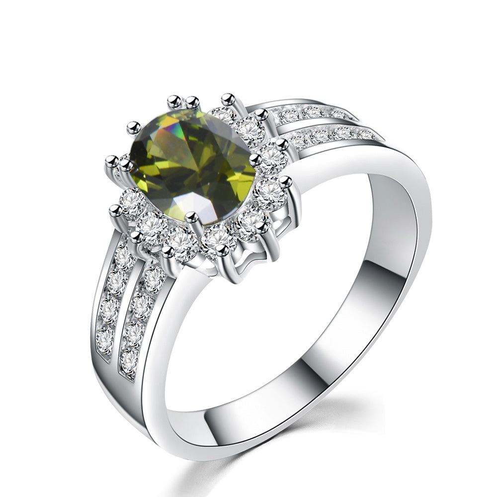 Damen Ring mit funkelndem grünem Edelstein und exquisiten Zirkonia-Verzierungen Shop Nory