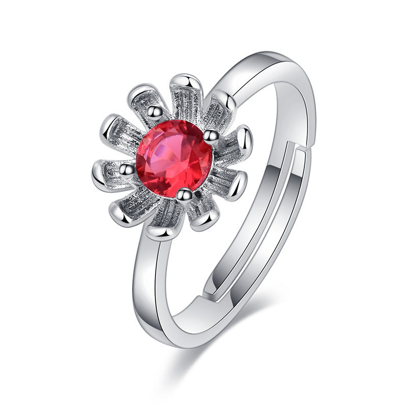 Damenring mit funkelndem rotem Edelstein und floralem Design Shop Nory