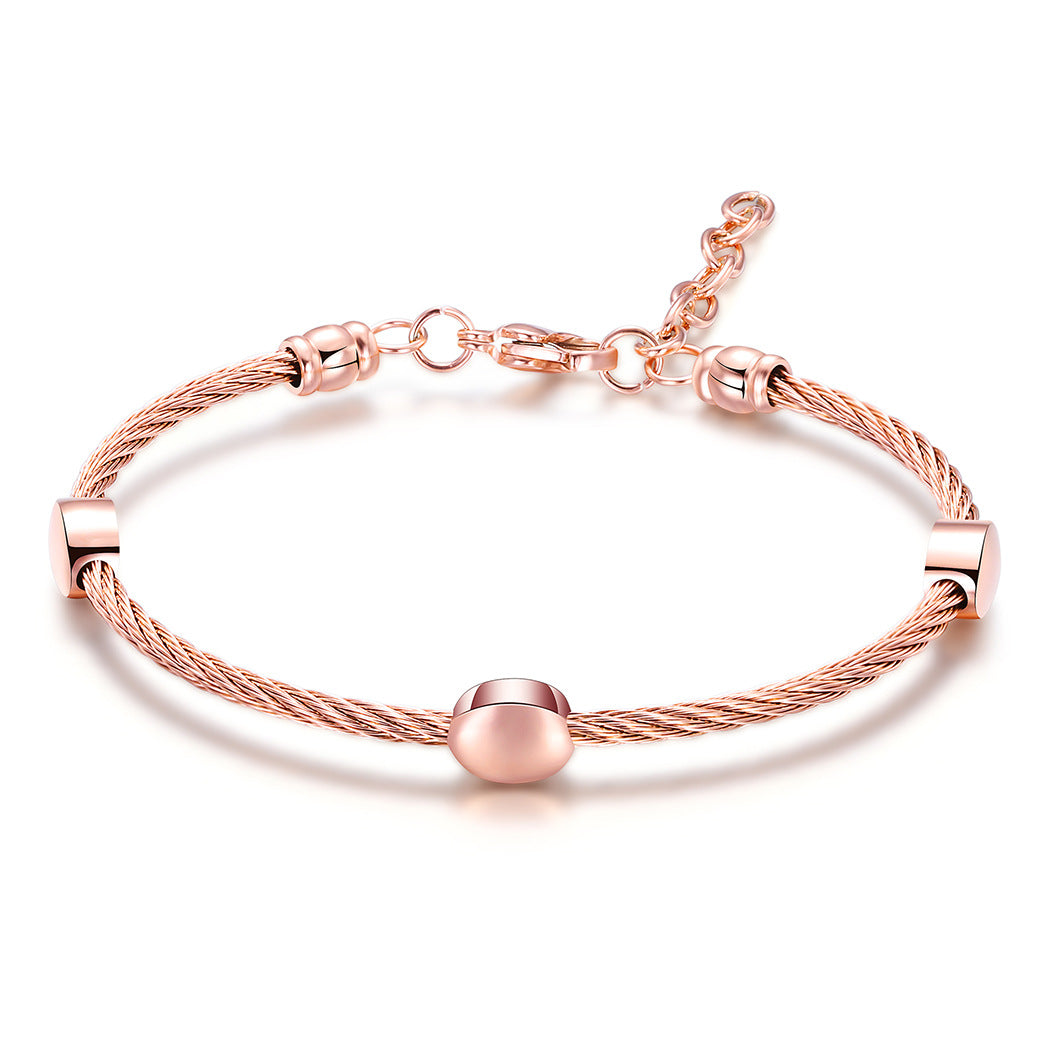 Damen Edelstahlarmband mit elegantem Kabeldesign und funkelnden Metallakzenten Shop Nory