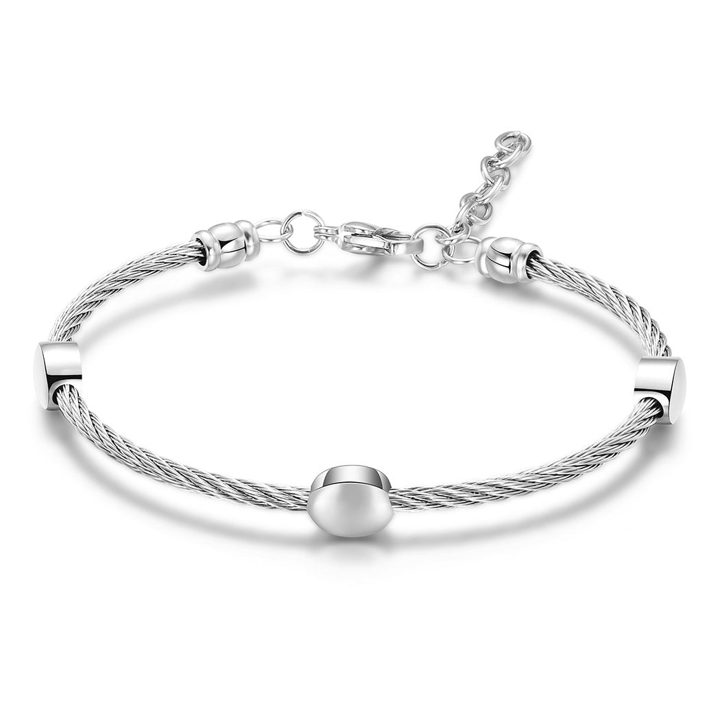 Damen Edelstahlarmband mit elegantem Kabeldesign und funkelnden Metallakzenten Shop Nory