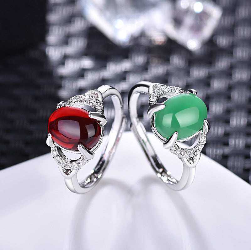 Damenring mit rotem Edelstein und funkelnden Zirkonia-Elementen Shop Nory