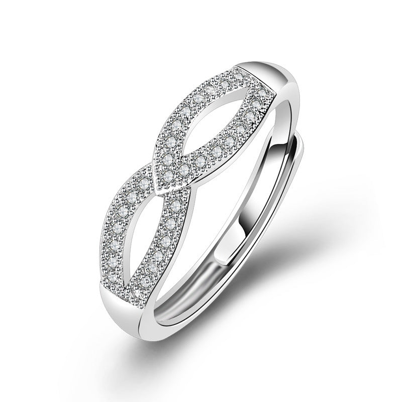 Damen filigraner Ring mit eleganter Schleifenstruktur und funkelndem Zirkonia Shop Nory