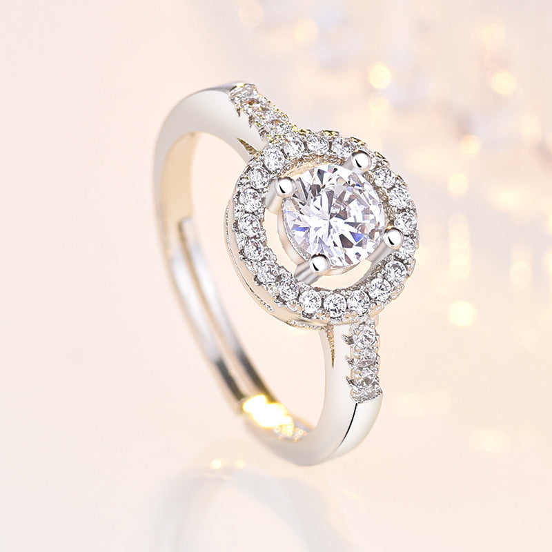 Damenring mit funkelndem Zirkonia und eleganter Umrandung Shop Nory
