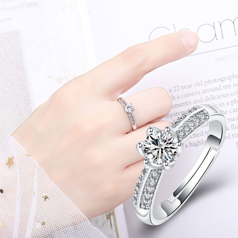 Damen Verlobungsring mit funkelndem Zirkonia-Besatz und eleganter Blumenkopfform Shop Nory