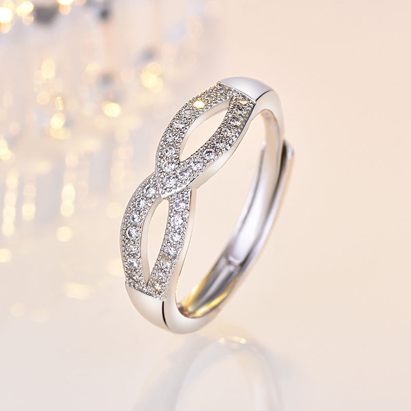 Damen filigraner Ring mit eleganter Schleifenstruktur und funkelndem Zirkonia Shop Nory