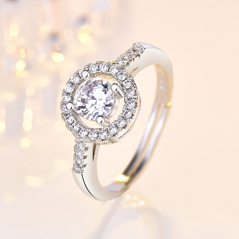 Damenring mit funkelndem Zirkonia und eleganter Umrandung Shop Nory