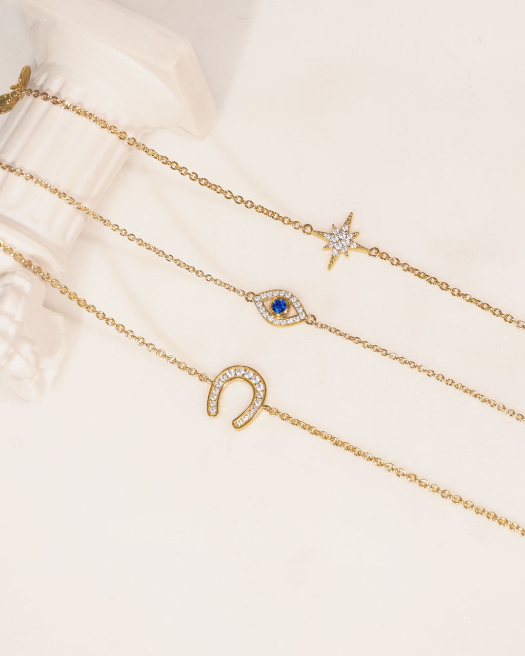 Glückliches böse Auge Kristall Gold Charm-Armband | Shop Nory