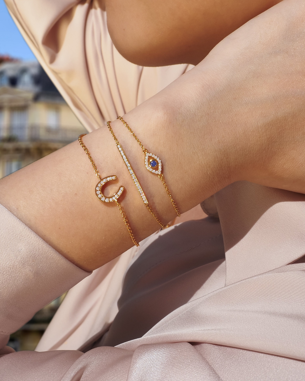 Glückliches böse Auge Kristall Gold Charm-Armband | Shop Nory