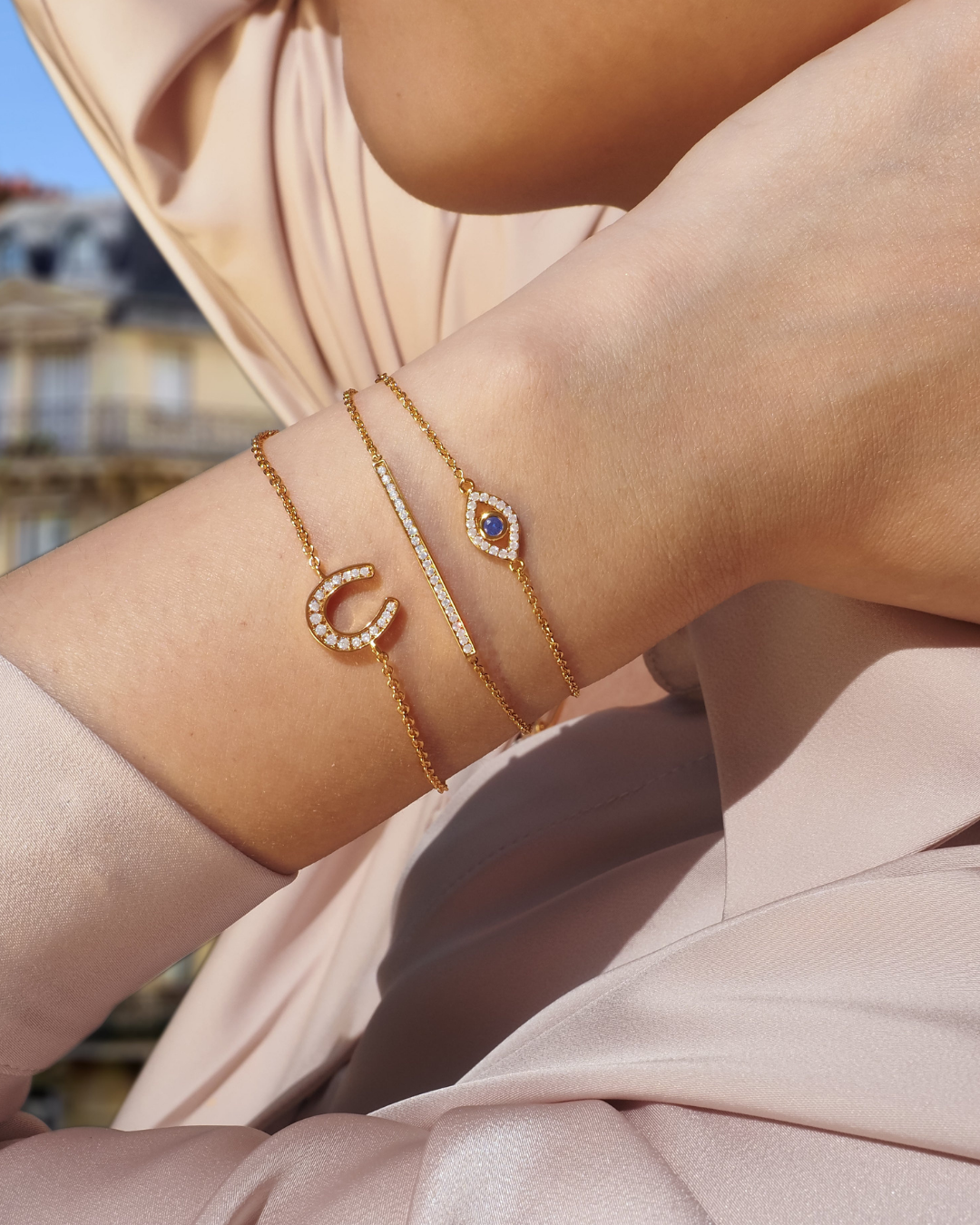 Glückliches böse Auge Kristall Gold Charm-Armband | Shop Nory
