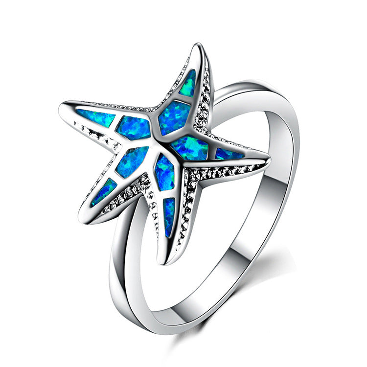 Damen Ring mit kunstvollem See-Stern-Design und schimmernden Opal-Elementen Shop Nory