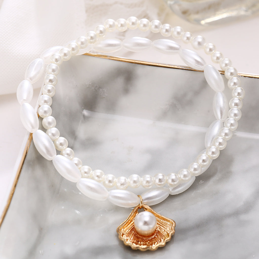 Damen Fußkettchen mit eleganten Perlen und Muschelanhänger Shop Nory