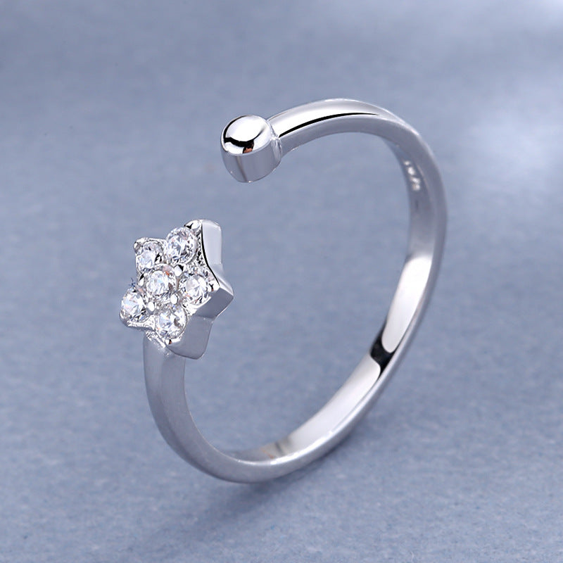 Damen Ring mit funkelndem Sternenanhänger und elegantem, offenen Design Shop Nory