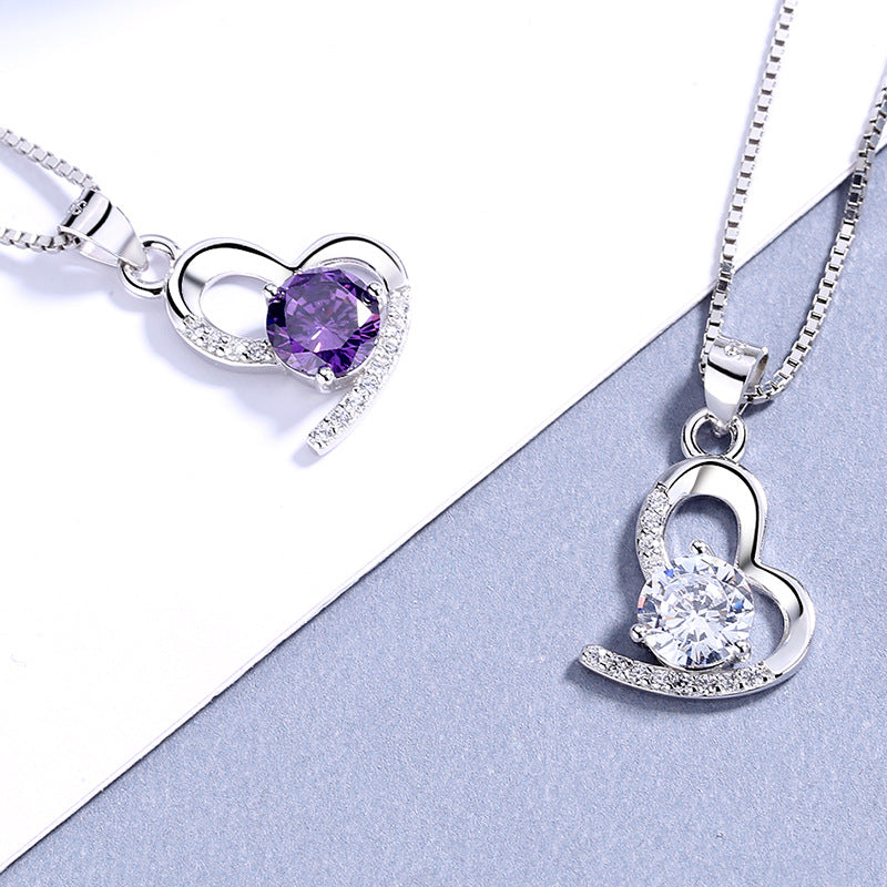 Damen Halskette mit einzigartigem herzförmigem Anhänger und leuchtendem Edelstein Shop Nory