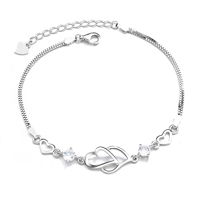Damen Armband mit doppeltem Herzdesign und funkelnden Amethyst-Steinen Shop Nory