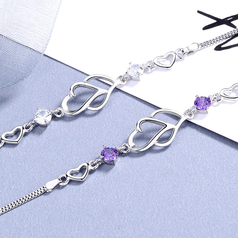 Damen Armband mit doppeltem Herzdesign und funkelnden Amethyststeinen Shop Nory