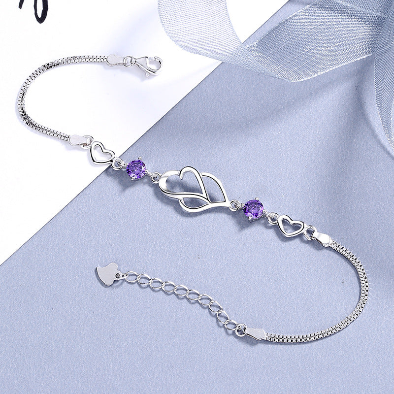 Damen Armband mit doppeltem Herzdesign und funkelnden Amethyst-Steinen Shop Nory
