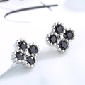 Damen Ohrstecker mit filigranem Blumendesign und funkelnden Akzenten Shop Nory