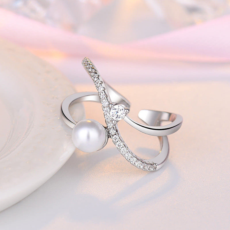 Damenring mit elegantem Perl-Design und funkelnden Zirkonia-Elementen Shop Nory