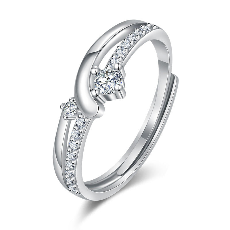 Damen Eleganter Ring mit geschwungenem Design und funkelndem Zirkonia-Besatz Shop Nory