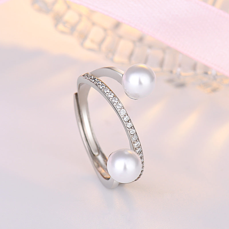 Damen offener Ring mit elegantem Perlenbesatz und funkelnden Zirkonia Shop Nory