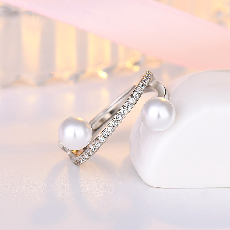 Damen offener Ring mit elegantem Perlenbesatz und funkelnden Zirkonia Shop Nory