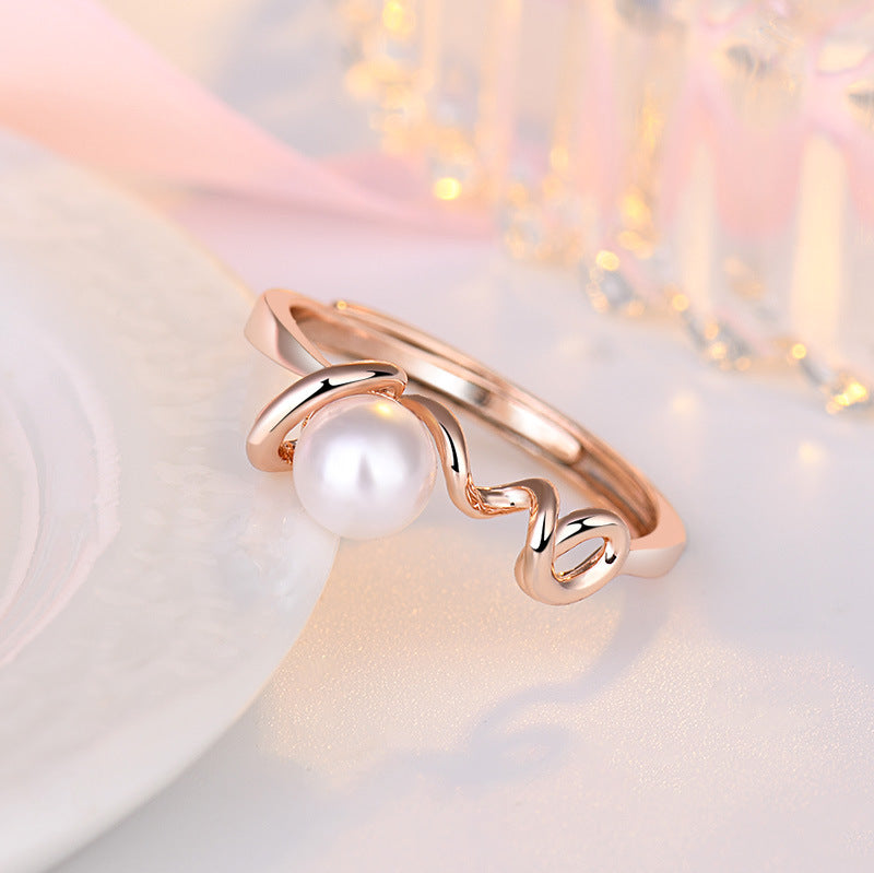Damenring mit kunstvollem Wellen-Design und einer hochwertigen Perle Shop Nory