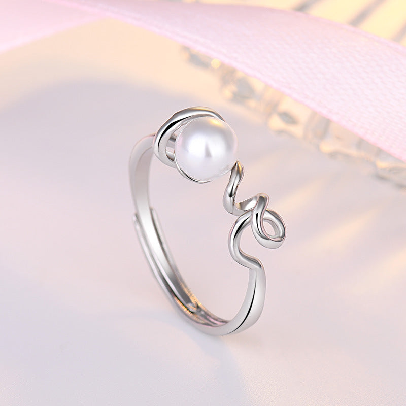 Damenring mit kunstvollem Wellen-Design und einer hochwertigen Perle Shop Nory