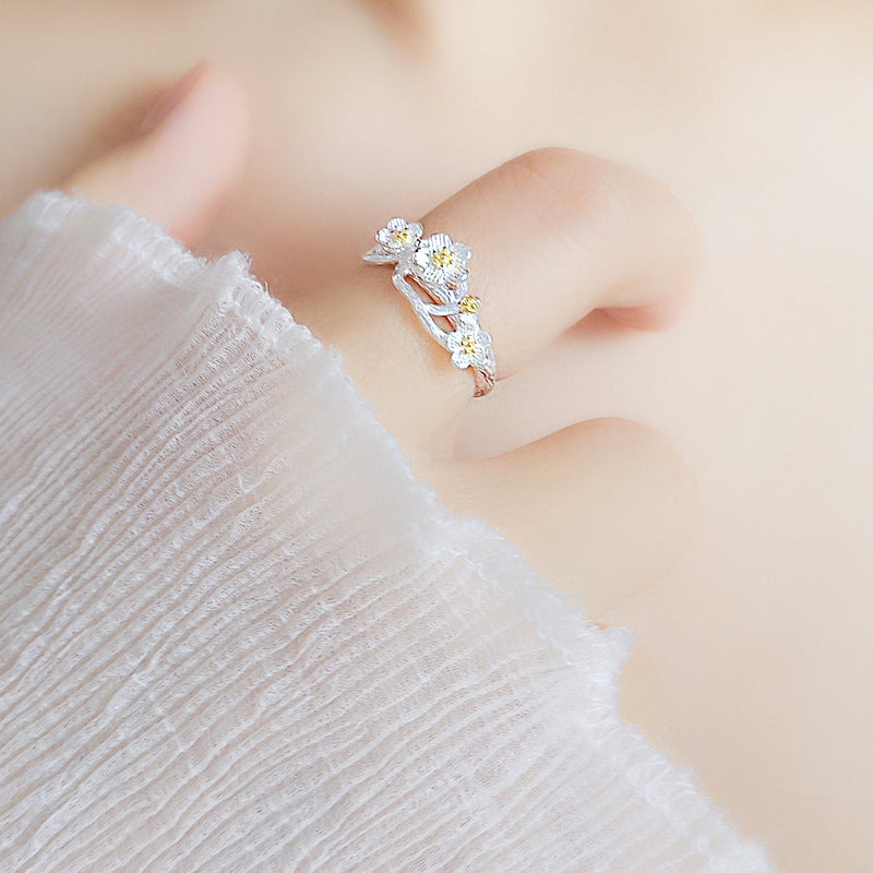 Damen filigraner Ring mit floralem Design und Goldakzenten Shop Nory