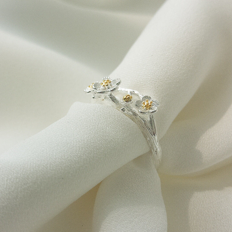 Damen filigraner Ring mit floralem Design und Goldakzenten Shop Nory