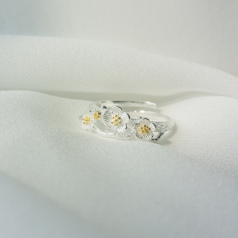 Damen filigraner Ring mit floralem Design und Goldakzenten Shop Nory