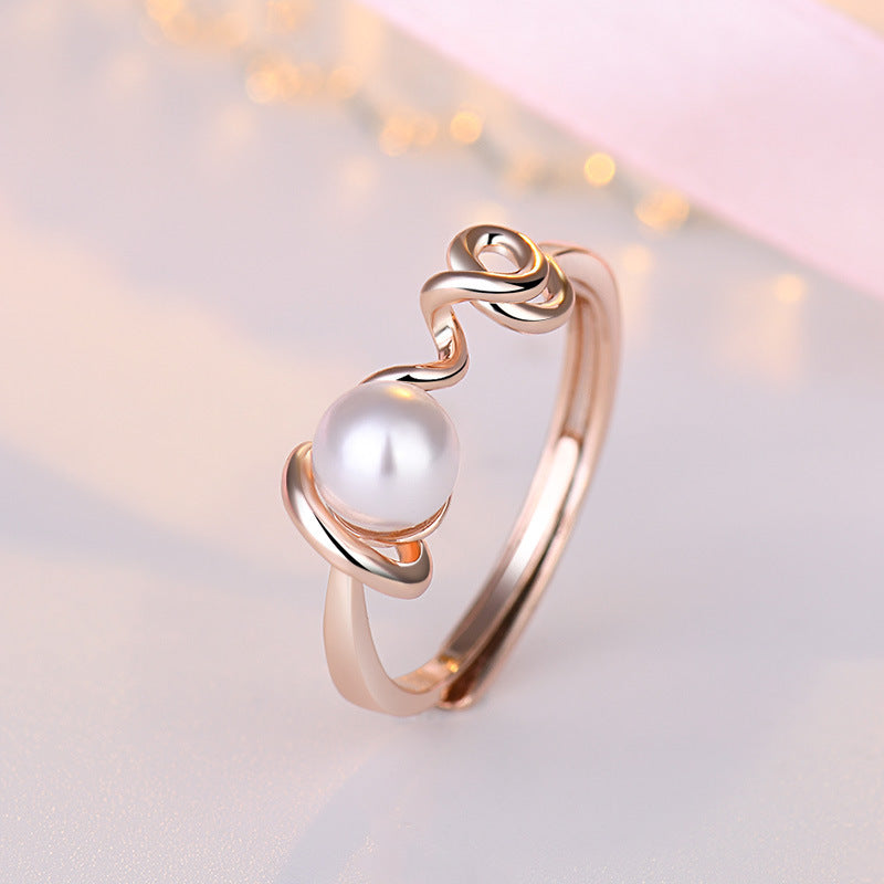 Damenring mit kunstvollem Wellen-Design und einer hochwertigen Perle Shop Nory