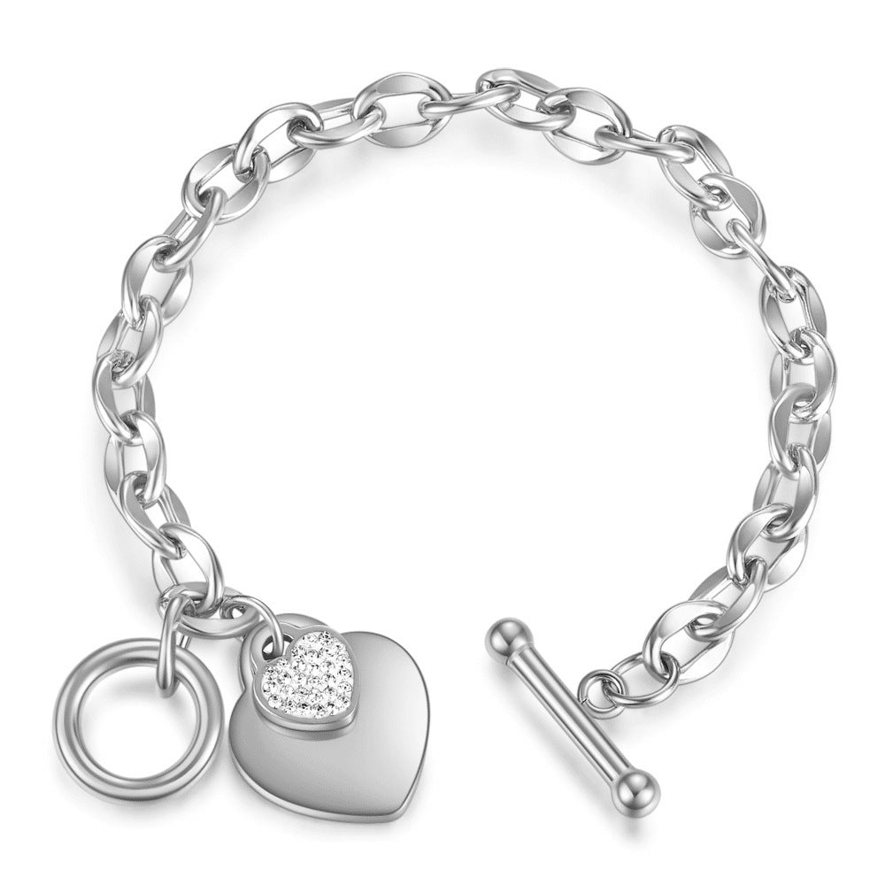 Damen Armband mit herzförmigem Anhänger und funkelnden Zirkonia Shop Nory