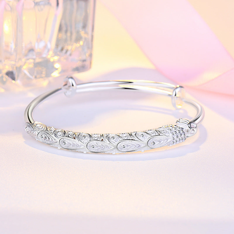 Damen Elegantes Armreif mit kunstvollem Federmotiv Shop Nory