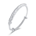Damen Elegantes Armreif mit kunstvollem Federmotiv Shop Nory