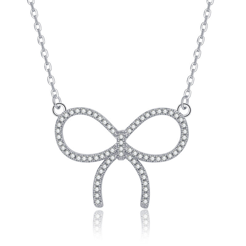 Damen Halskette mit funkelndem Schleifenanhänger und hochwertigem Zirkonia-Besatz Shop Nory