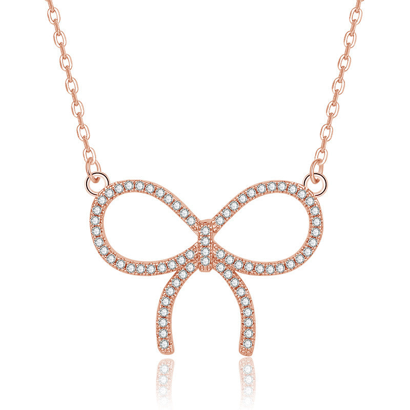 Damen Halskette mit funkelndem Schleifenanhänger und hochwertigem Zirkonia-Besatz Shop Nory