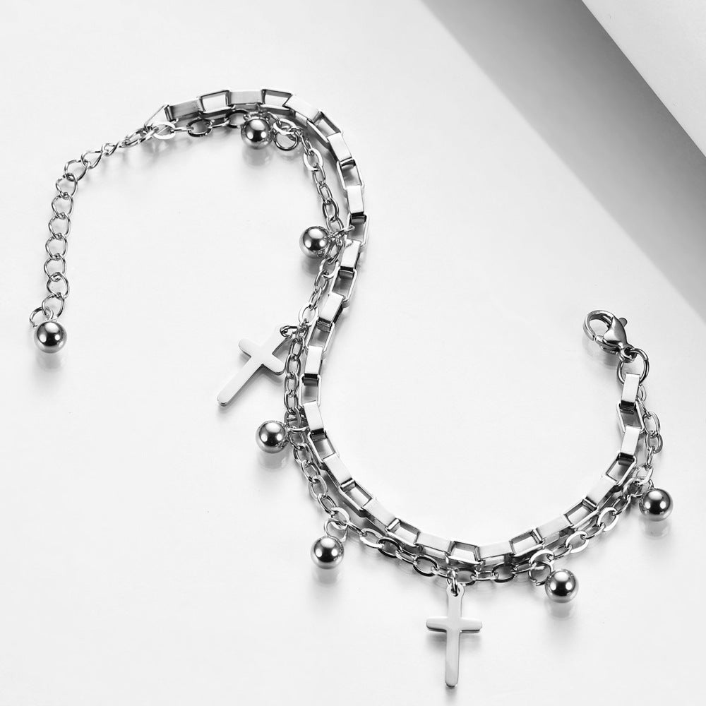 Damen Armband mit eleganter Kettenstruktur und trendigem Kreuzanhänger Shop Nory