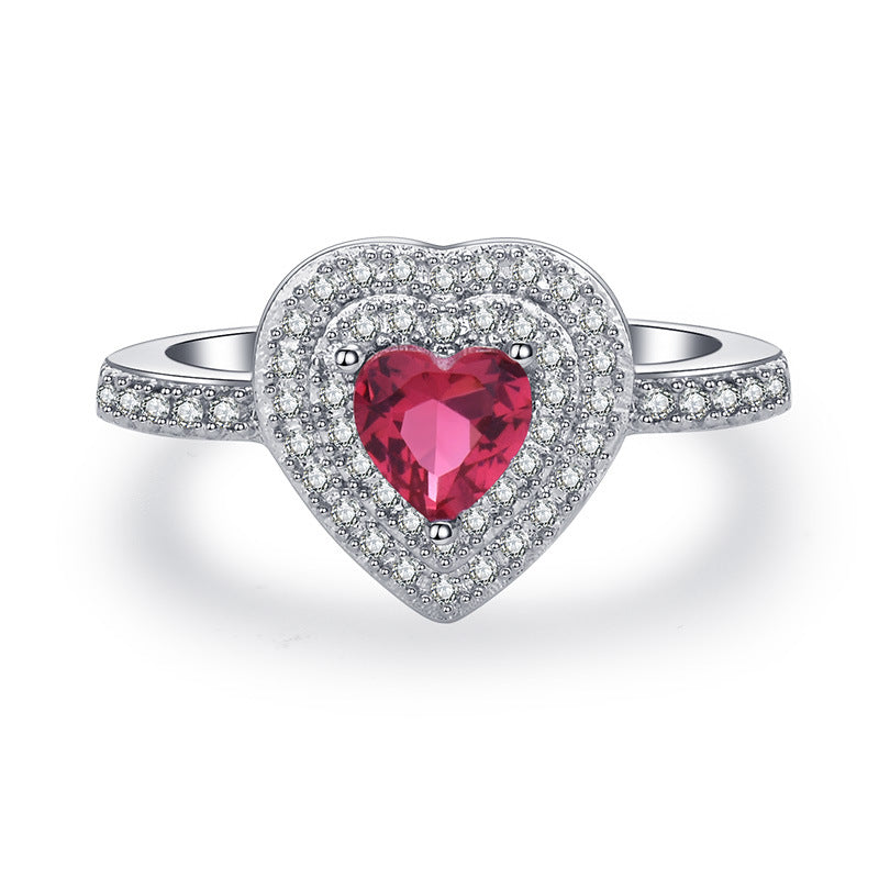 Damen Ring mit herzförmigem Rubin und funkelndem Zirkonia-Besatz Shop Nory