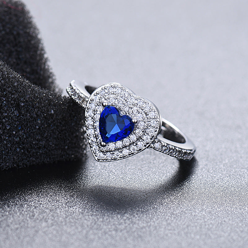 Damen Ring mit herzförmigem Rubin und funkelndem Zirkonia-Besatz Shop Nory