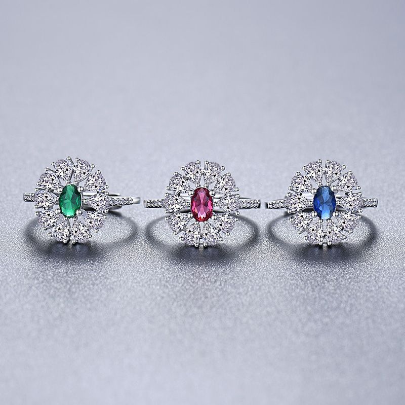 Damen eleganter Ring mit funkelndem Rubin und kunstvollem Zirkonia-Besatz Shop Nory