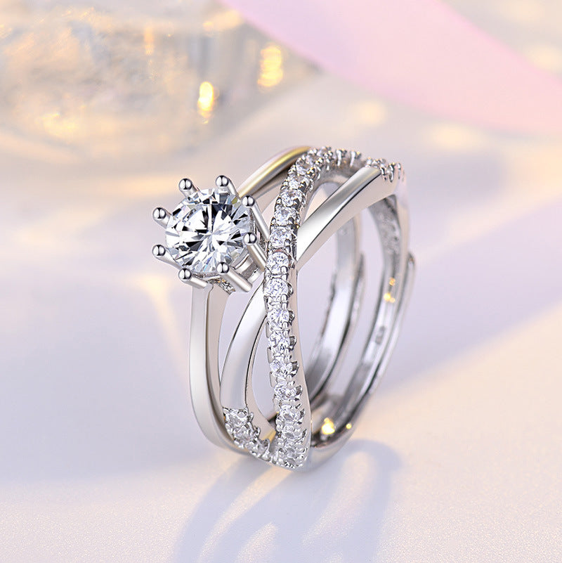 Damen-Verlobungsring mit kunstvollem Zirkonia-Besatz und eleganter Drahtarbeit Shop Nory