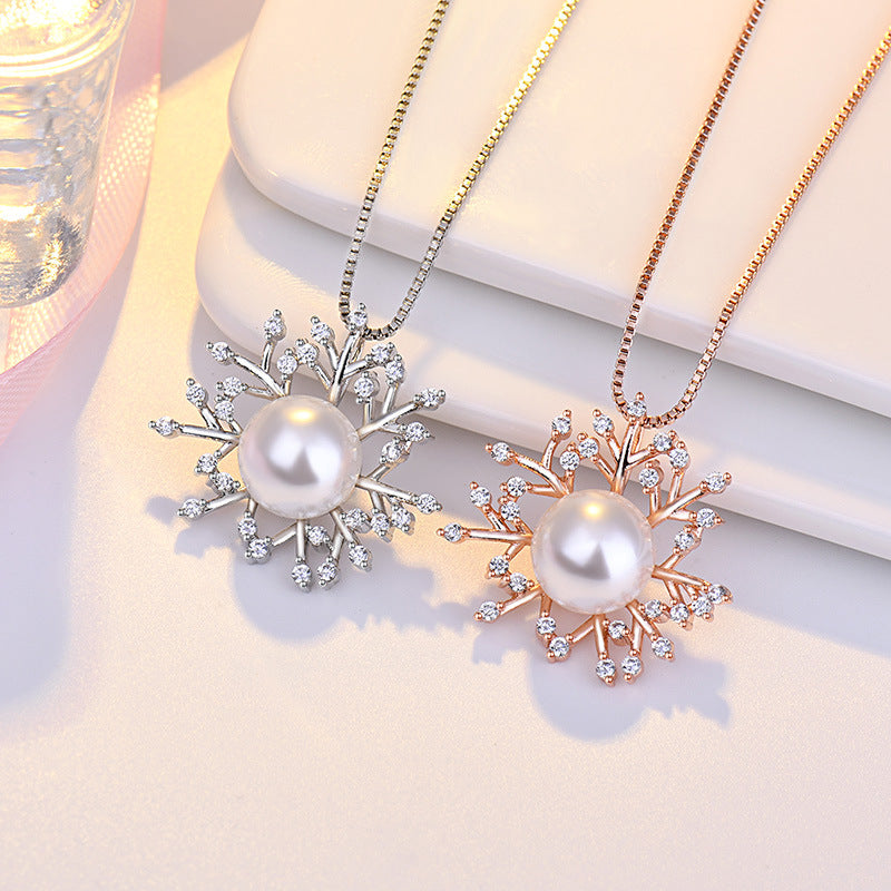 Damen Halskette mit elegantem Schneeflockenanhänger und luxuriöser Perle Shop Nory