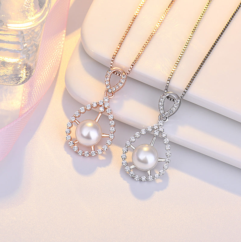 Damen Halskette mit luxuriösem Perlenanhänger und funkelnden Zirkonia-Elementen Shop Nory