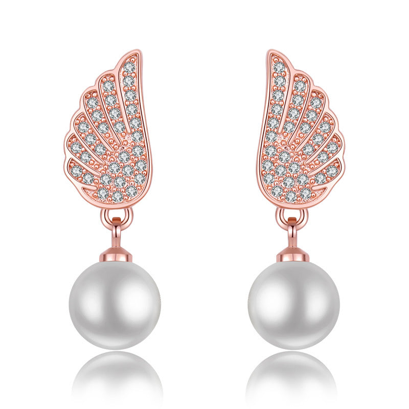 Damen Ohrringe mit elegantem Flügel-Design und Perlenanhänger Shop Nory